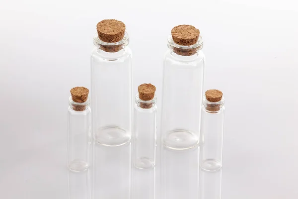 Glass container with cork stopper on white background. — Stock Photo, Image