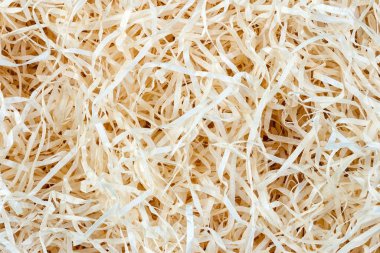 Wood background. Close-up of wooden shavings for packing.