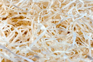 Wood background. Close-up of wooden shavings for packing.