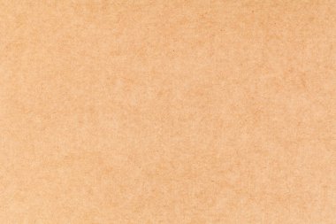Bir yaprak kağıt kahverengi karton. Doku yakın plan, doğal kaba desenli kağıt arka plan.