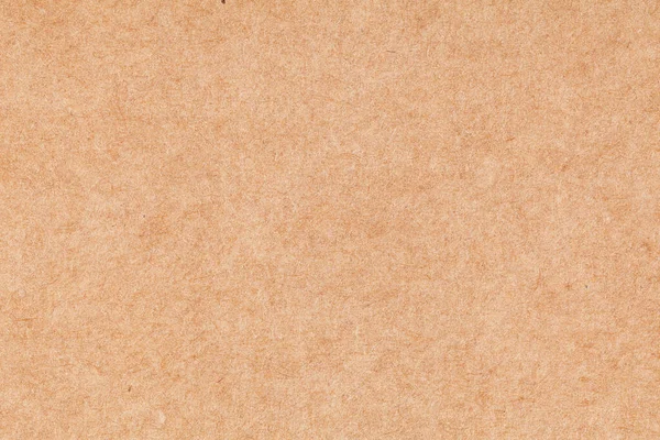 Bir yaprak kağıt kahverengi karton. Doku yakın plan, doğal kaba desenli kağıt arka plan.