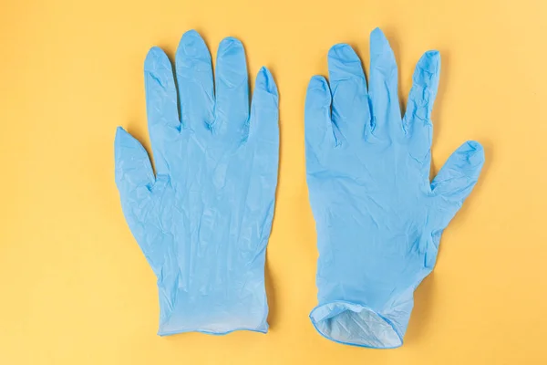 Two Rubber Gloves Yellow Background Corona Virus Healthcare Medical Concept — Stock Photo, Image
