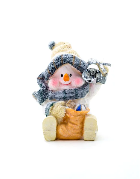 Figurine cheerful snowman holding a bell on a white background. — Stock Photo, Image