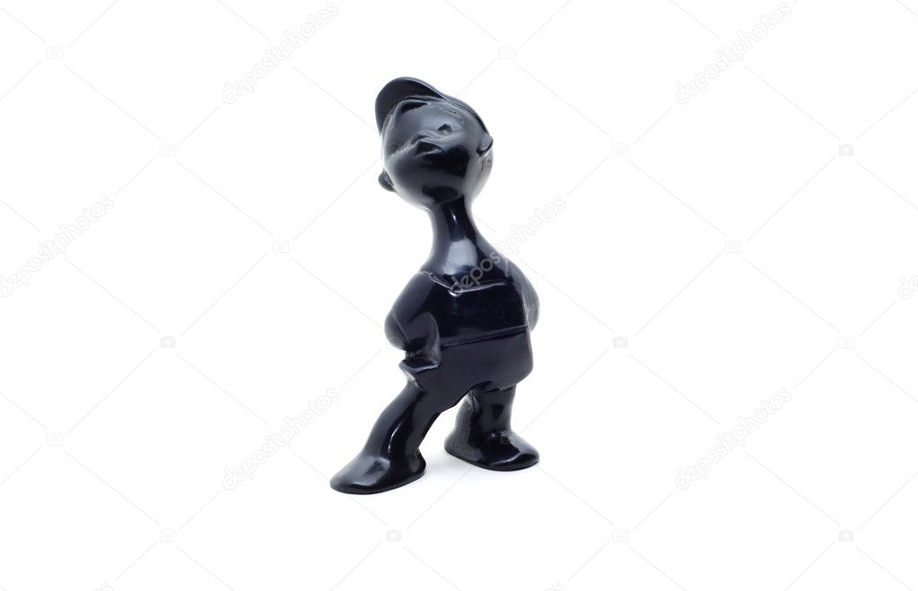 Ceramic statuette of a funny boy on a white background.