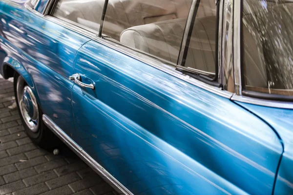 Side doors of a blue vintage car — Stock Photo, Image