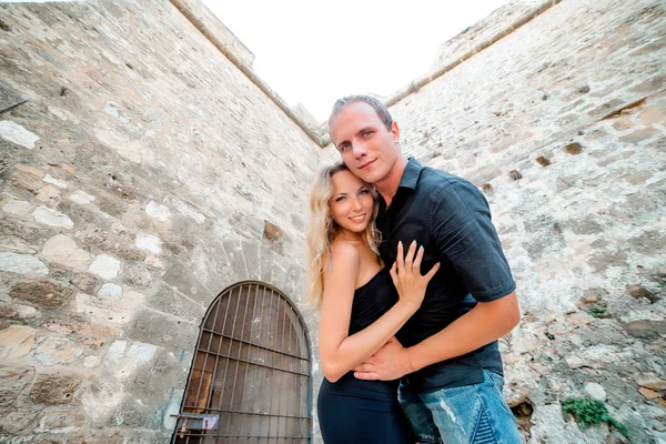 Couple walking in the city of Denia, Spain on summer day