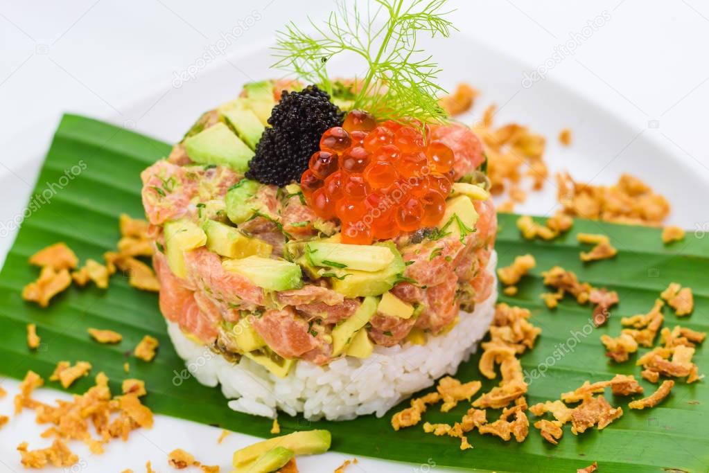 Smoked salmon tartare with avocado, rice and caviar