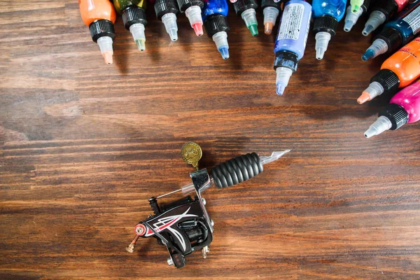 Top view of tattoo needle and inks