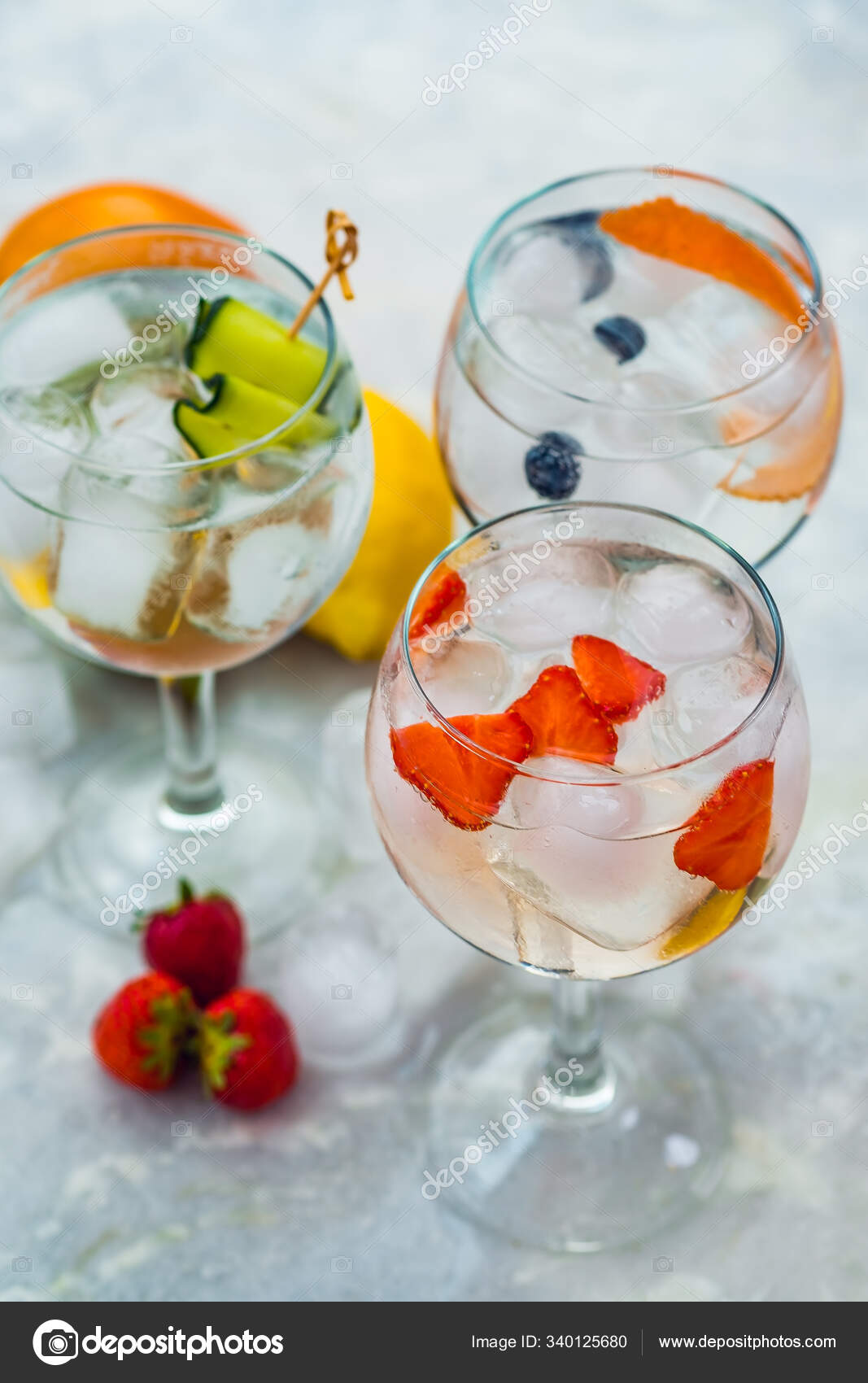 Close Up Of Three Gin Tonic Cocktails With Strawberries Lime And Blueberries Stock Photo C Bobakphoto Gmail Com 340125680
