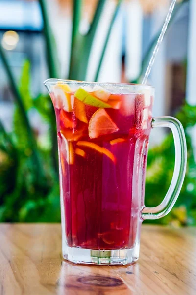 Close-up of a jar of traditional Spanish sangria prepared of red wine and different fruits. — Stock Photo, Image