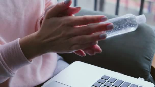 Close Freelancer Working Laptop Cleaning Hands Hand Sanitizer Coronavirus Pandemic — Stock Video