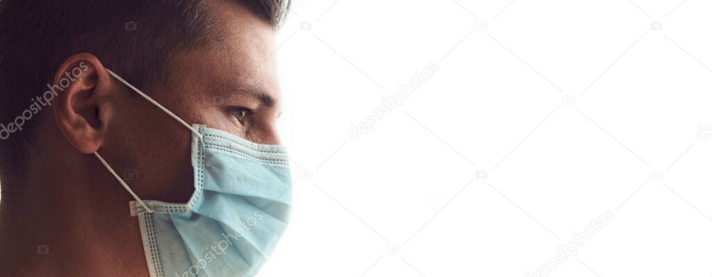 Profile of young sad and tired doctor in medical mask isolated on white background. Coronavirus, Covid-19, 2019-nCoV pandemic. Quarantine, stay at home. Copy space.