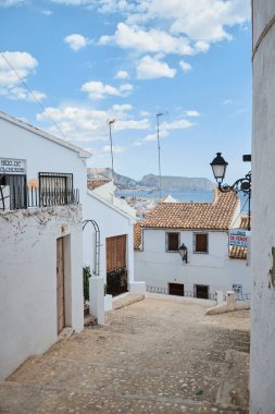 Spain Altea old town on September 10, 2019 in Costa Blanca Alicante Spain. Typical spanish street white houses clipart
