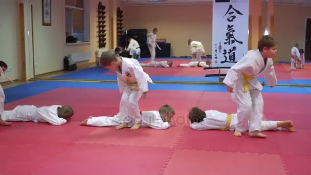 KIEV, UKRAINE - February 6, 2017: Taekwondo training the children do exercise a somersault back — Stock Video