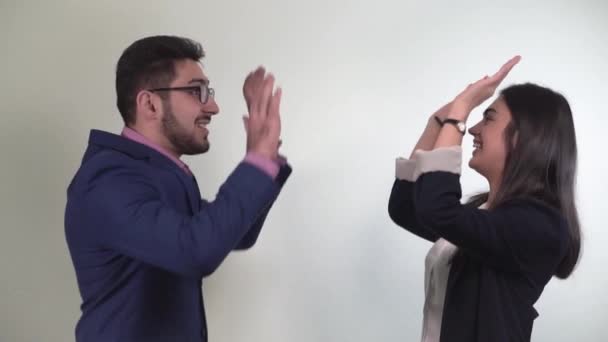 Business partners give a high five as a sign of successful completion of negotiations and they agreed to work together — Stock Video