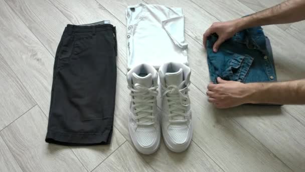 Overhead view of mens clothing set. Thumb up. — Stock Video