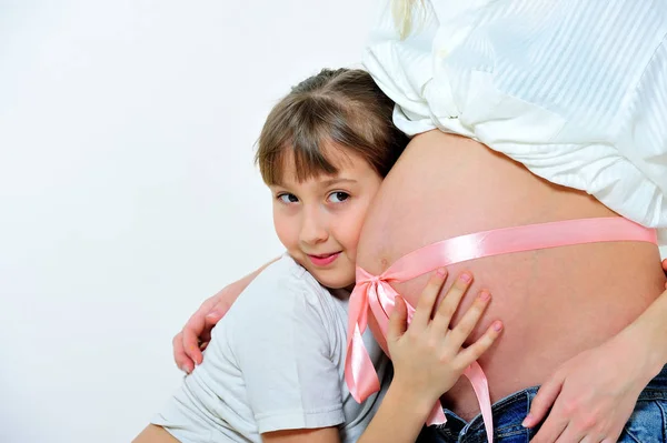 Little Girl Embraces Stomach Pregnant Mother Tied Pink Ribbon Portrait — Stock Photo, Image