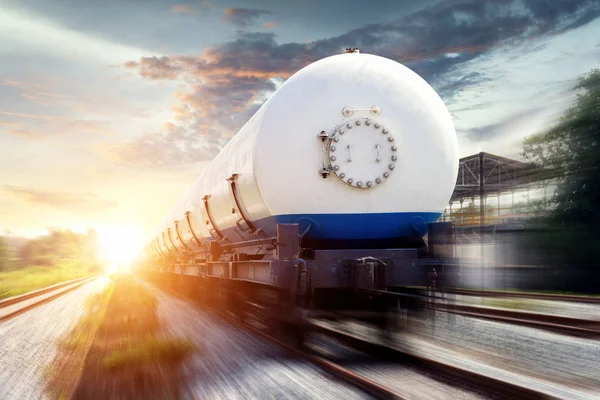 Tanks with gas being transported by rail at sunset — Stock Photo, Image