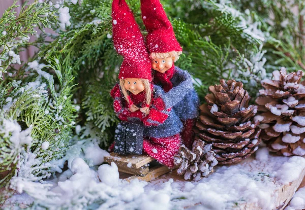 Christmas tale. Children gnomes sleigh ride in the winter forest