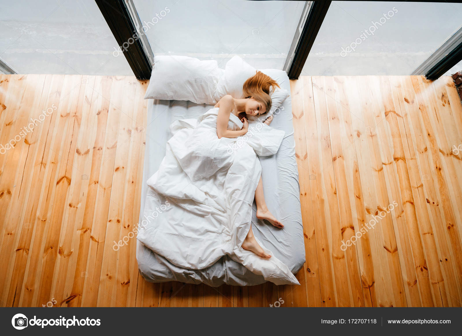 Young Skinny Beautiful Barefoot Girl Lying In White Comfortable