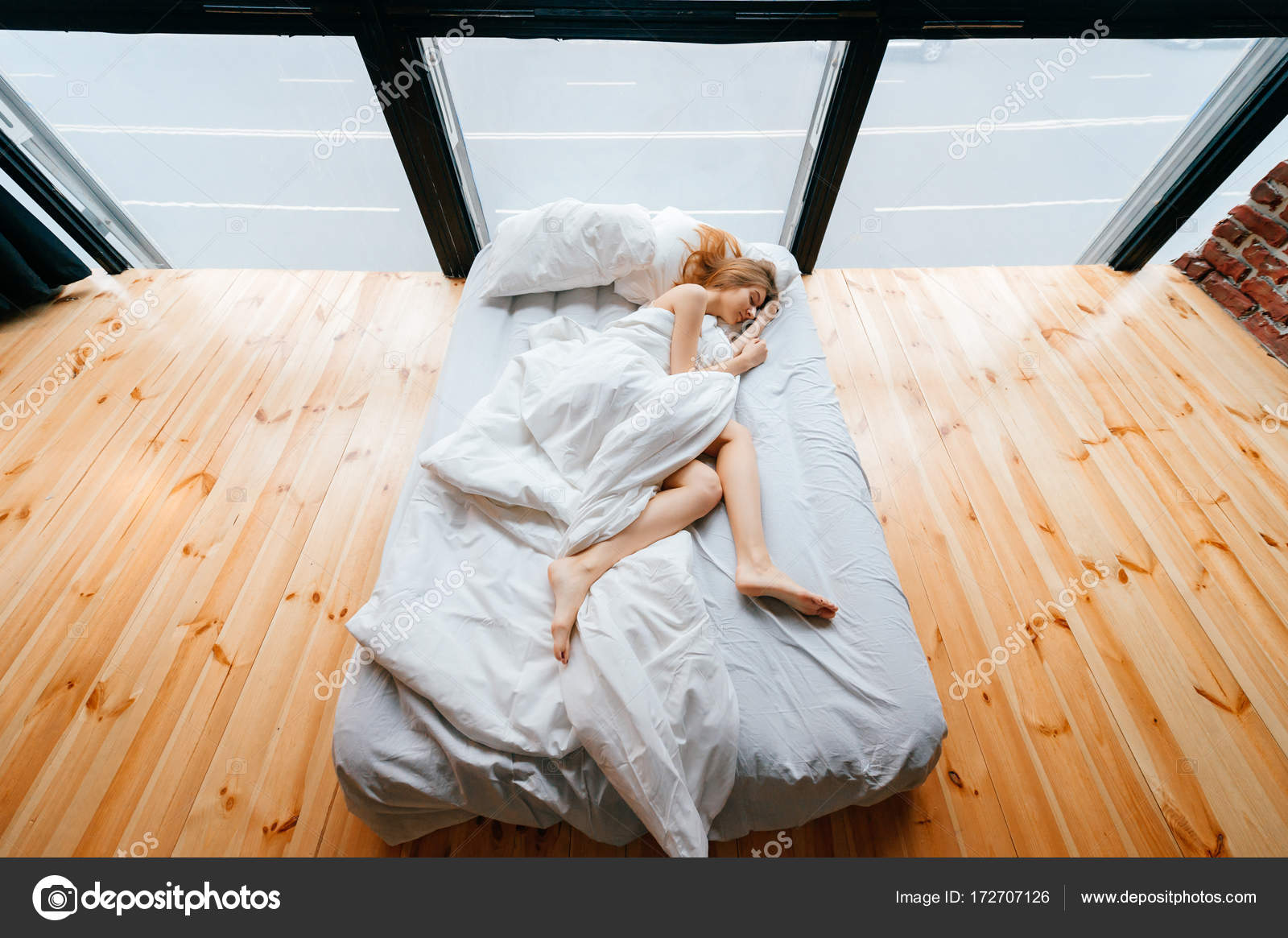 Young Skinny Beautiful Barefoot Girl Lying In White Comfortable