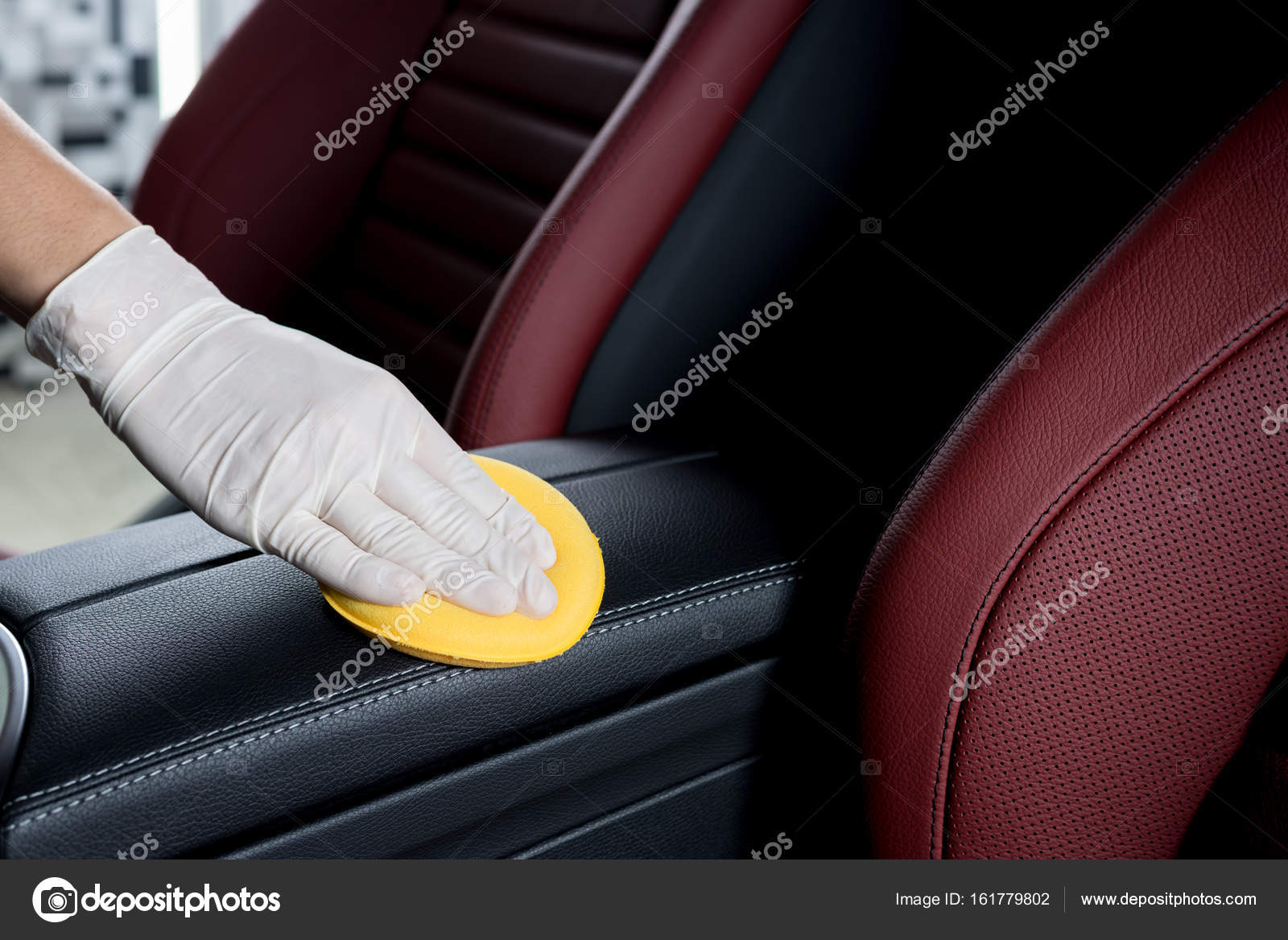 Car detailing series Closeup of hands cleaning car interior Stock