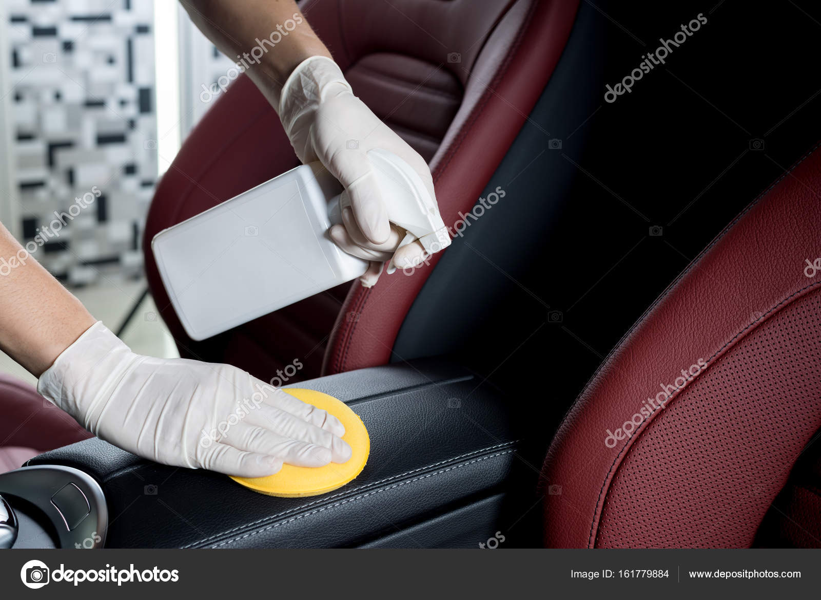 Car detailing series Closeup of hands cleaning car interior Stock