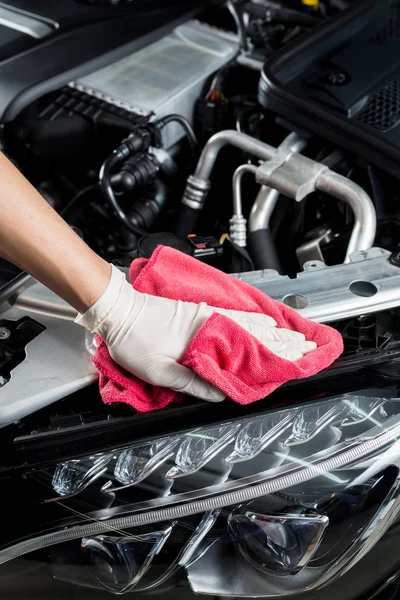 Car detailing series: Closeup of hand cleaning car engine — Stock Photo, Image