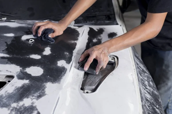 Auto body repair series: Closeup of mechanic wet-sanding car bonnet — Stock Photo, Image