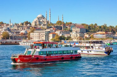 ISTANBUL, TURKEY -  October 9th, 2019: View to Eminonu pier and Suleymaniye mosque across Bay of Golden Horn on sunny morning