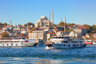 ISTANBUL, TURKEY -  October 9th, 2019: View to Eminonu pier and Suleymaniye mosque across Bay of Golden Horn on sunny morning