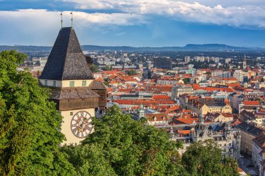 GRAZ, AUSTRIA - July 12th, 2019: Aerial view to the city of Graz with Clock tower, the symbol og the city, and the Town hall below