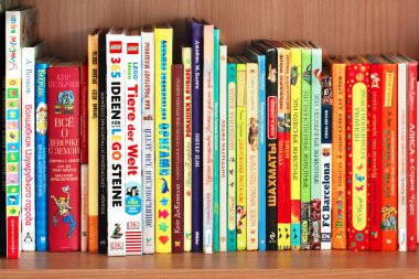 KHARKIV, UKRAINE - January 24th, 2019: Book shelf with children books in bright colorful covers