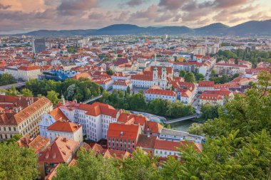 GRAZ, AUSTRIA - July 12th, 2019: Aerial view to the city of Graz at sunset