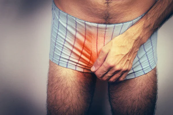 Man having a problem with his penis — Stock Image Man having a problem with his penis Stock Image
