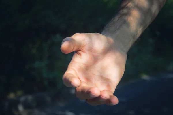 young man gives a hand for help