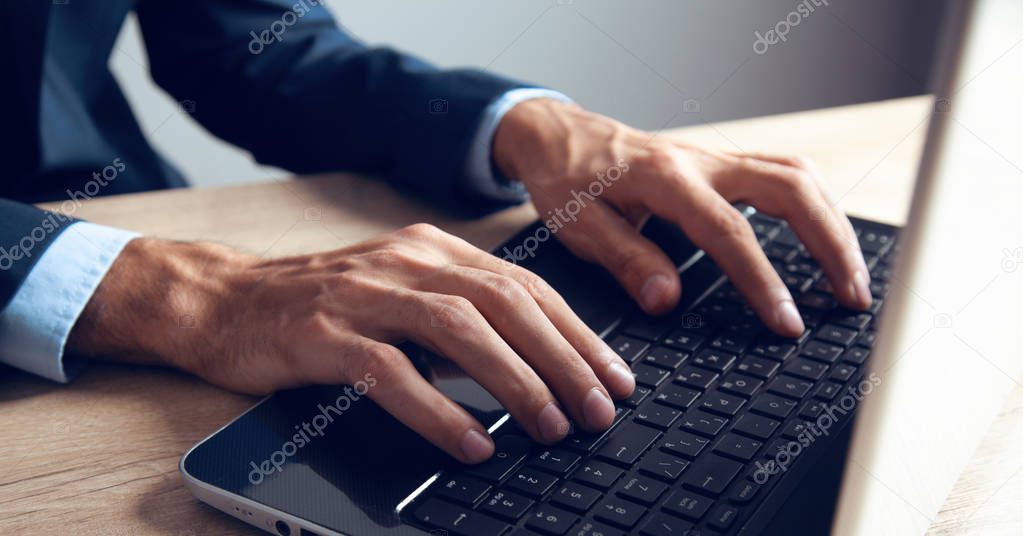 young man works with computer