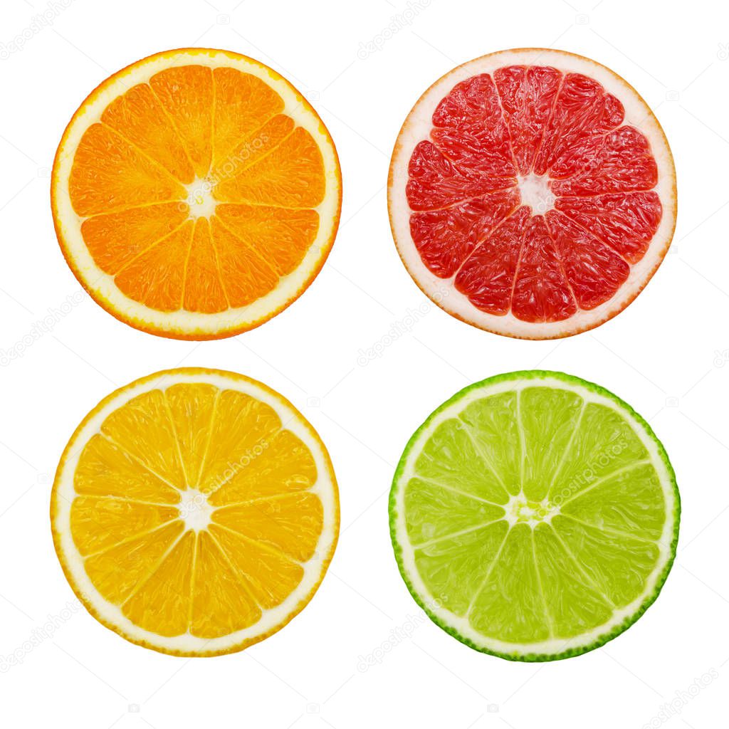 Cut slices of lime and lemon, orange, pink grapefruit isolated on white background