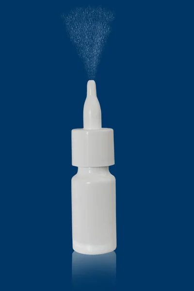 The nasal spray bottle on blue background — Stock Photo, Image