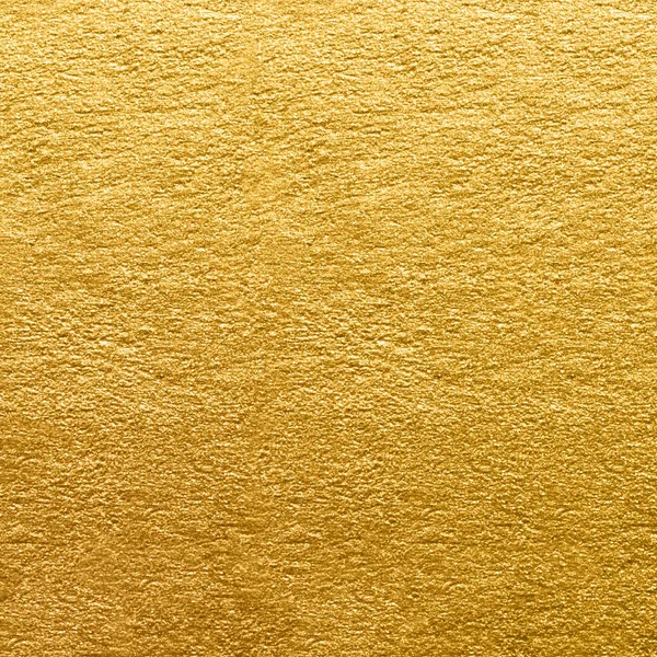 Textura de folha de ouro. Fundo de parede dourada close-up — Fotografia de Stock