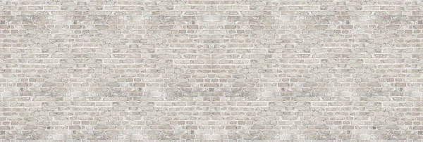 Vintage white wash brick wall texture for design. Panoramic background for your text or image.