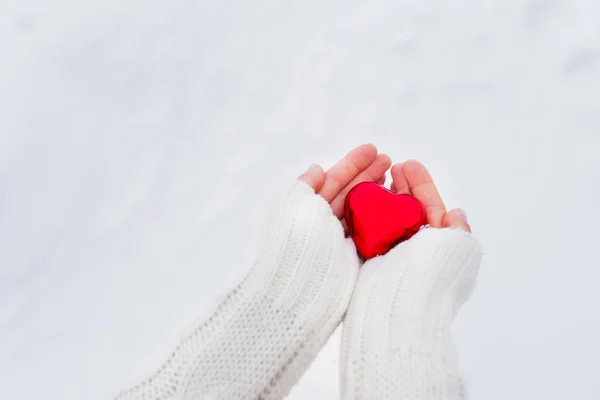 Girl holding red heart in her hands — Stock Photo, Image
