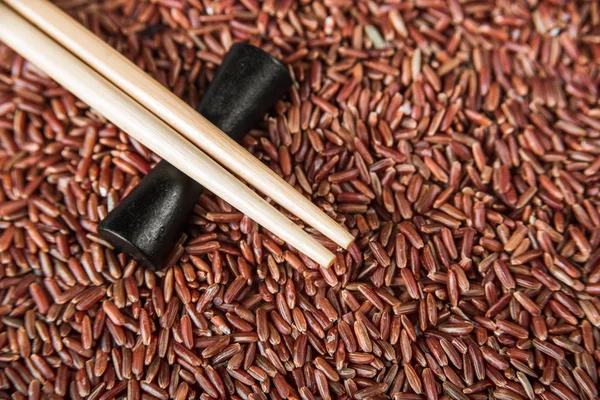 Wild red rice with sticks closeup