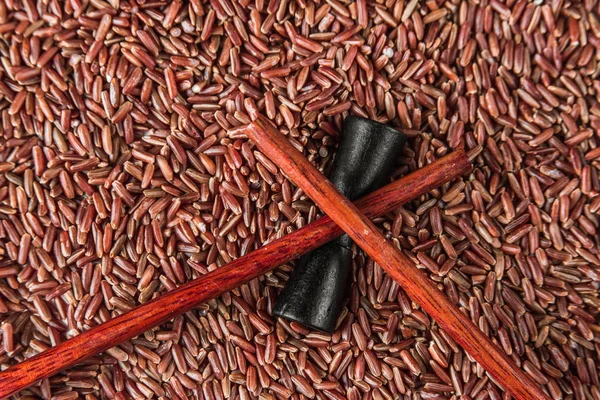 Wild red rice with sticks closeup