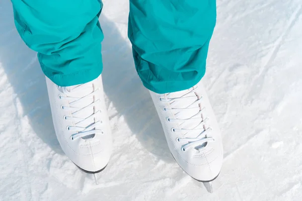 Female figure skates on the ice