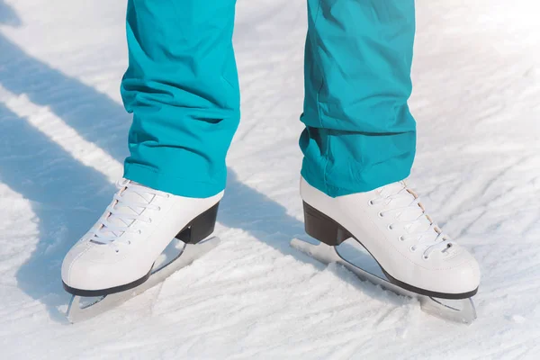 Female figure skates on the ice