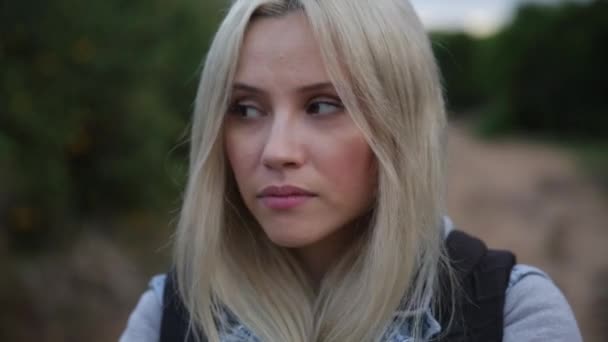 Sad alone hope - Closeup side profile portrait of young woman outdoors serious pensive. Unhappy teen girl face thinking and looking ahead — Stock Video