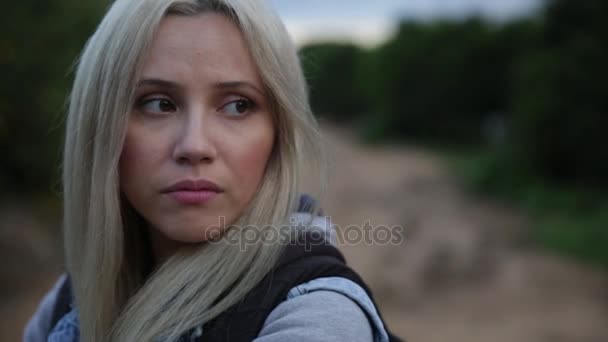 Sad alone hope - Closeup side profile portrait of young woman outdoors serious pensive. Unhappy teen girl face thinking and looking ahead — Stock Video