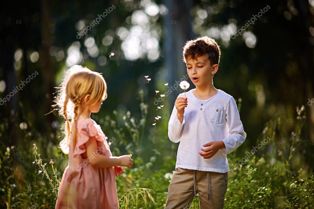 Young Boy and Girl Talking in the Spring. Carefree
