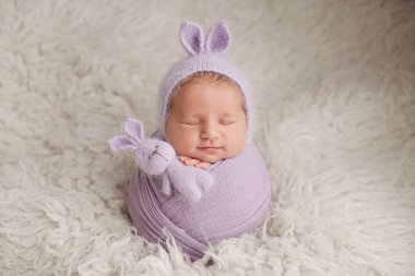 newborn boy. photo session of a newborn. newborn baby in a Bunny hat